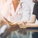 Doctor and patient consulting on a table