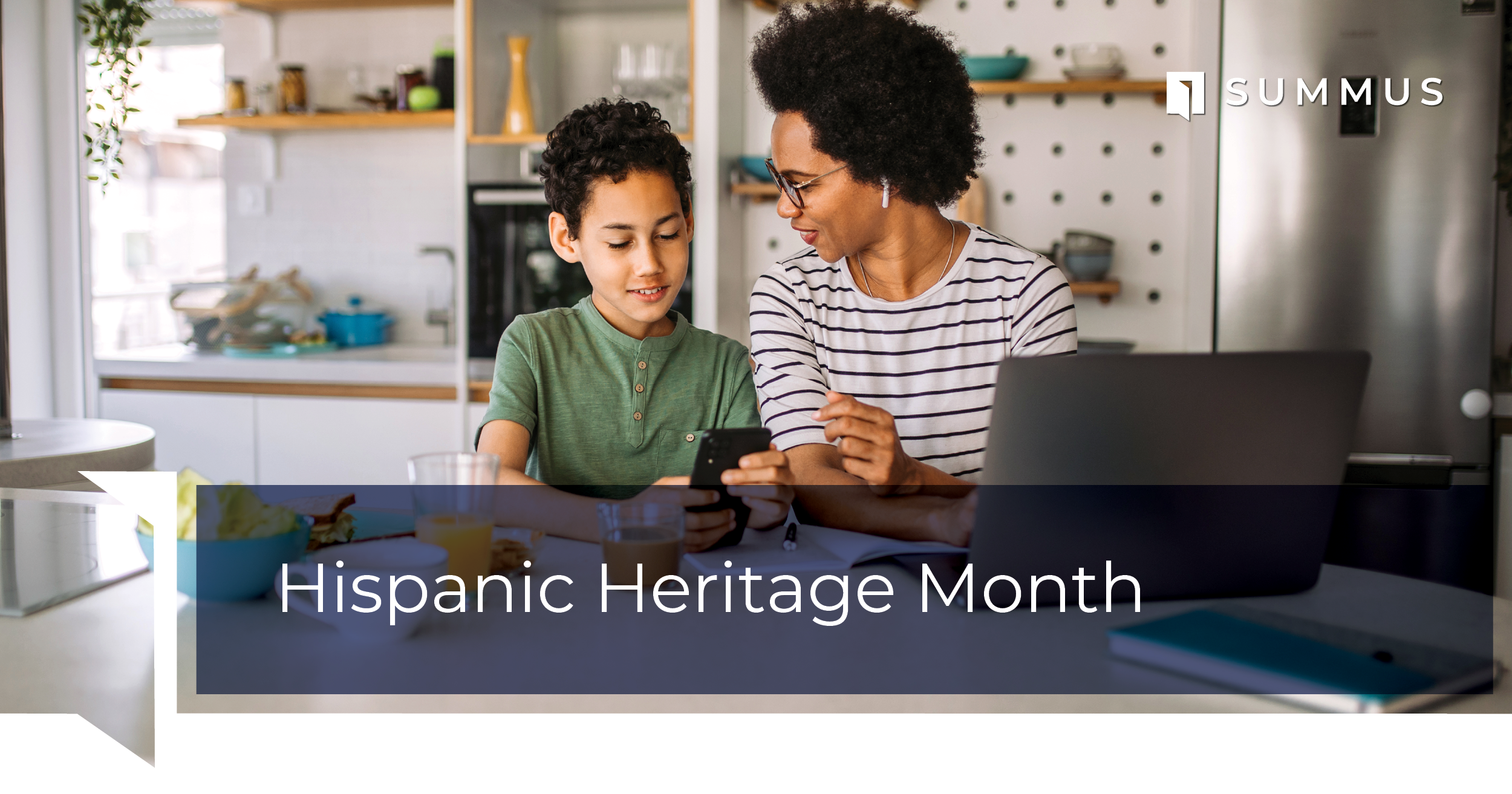 Hispanic mother and teenage son sitting at a kitchen table.